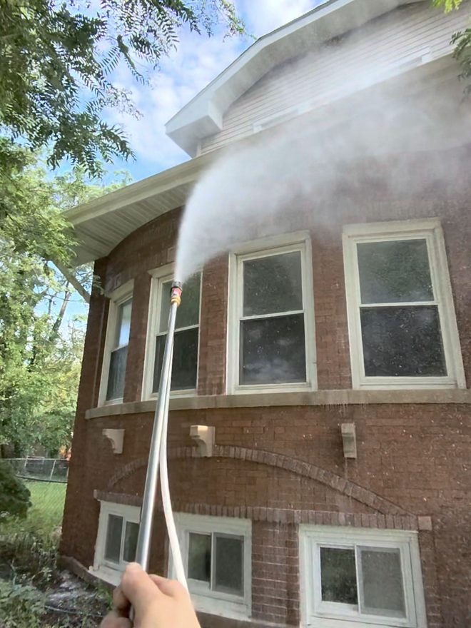 Soft washing brick siding with detergent